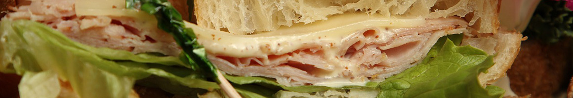 Eating Deli Sandwich at Brookside Deli restaurant in Bakersfield, CA.